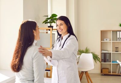 Friendly,Woman,Doctor,Supporting,Her,Female,Patient,During,Medical,Examination