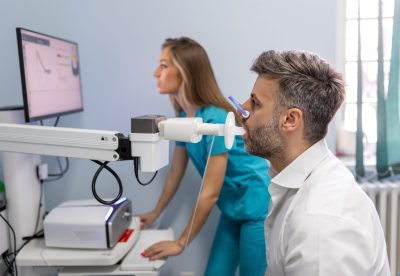 Man,Performing,Pulmonary,Function,Test,And,Spirometry,Using,Spirometer,At